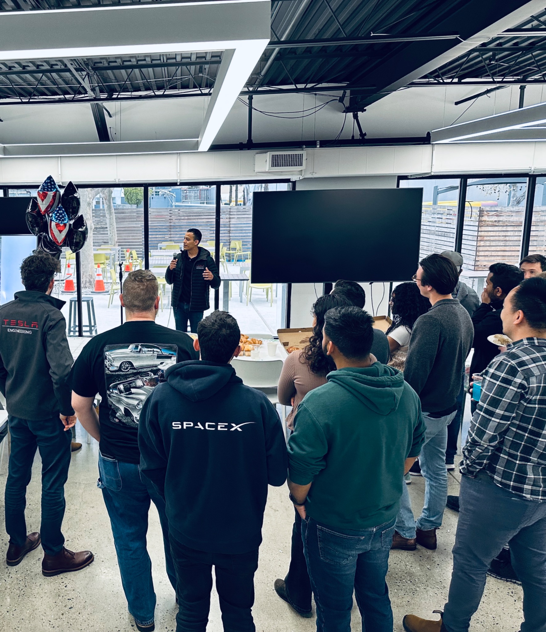 John delivering his farewell speech to the cell team.